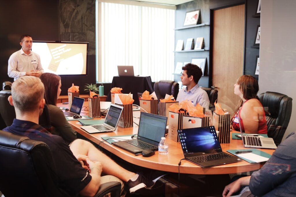 A team in an office discussing email capture during a meeting